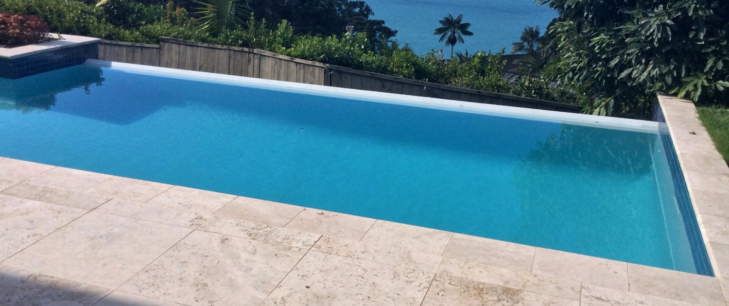 image of a pool with an ocean view in the background